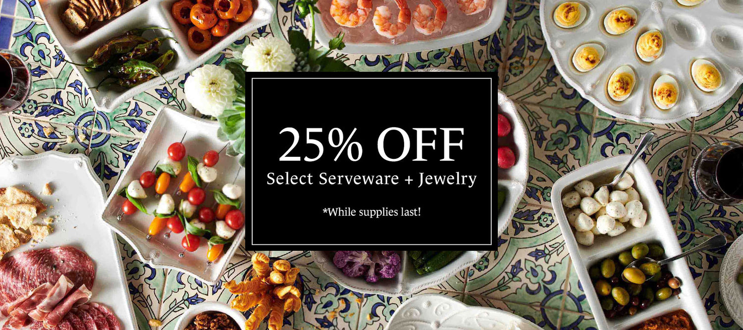 Table with various food items and a promotional banner for 25% off select serveware and jewelry.