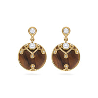 These alluring earrings are a paradoxical pairing of lustrous pearls and hand-carved teak wood accented with tiny crystals. These are stunning when paired with our Elizabetta Pearl Necklace or any of our other teak wood necklaces.