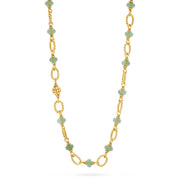 A gold chain necklace featuring alternating light green faceted beads and twisted gold links, displayed against a solid white background.