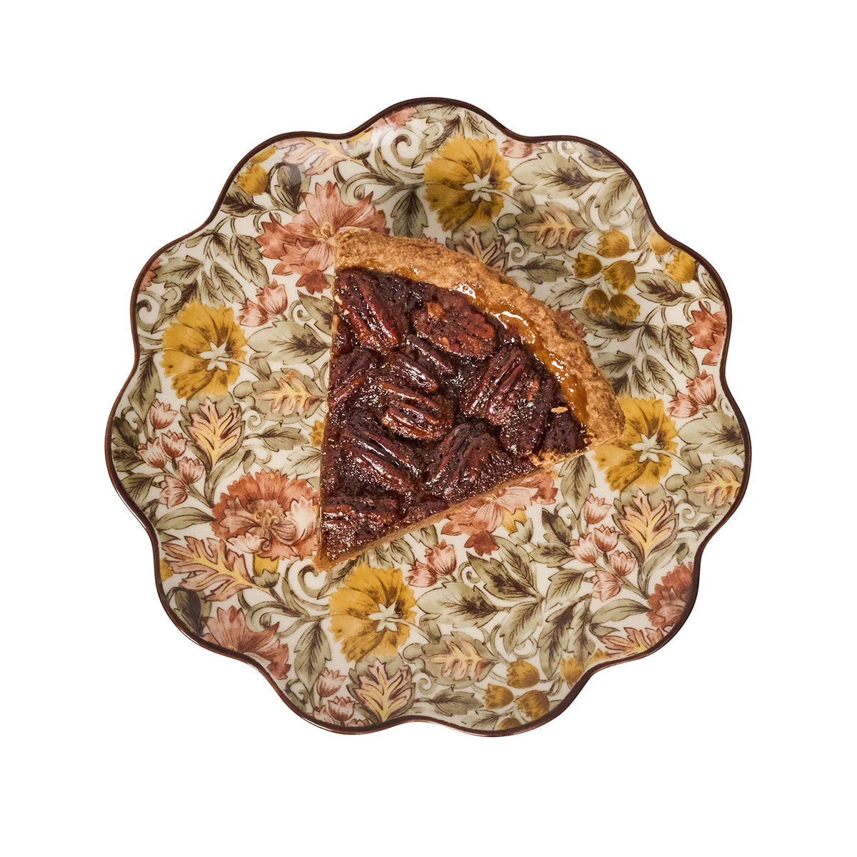 Slice of pecan pie on a decorative plate with floral pattern