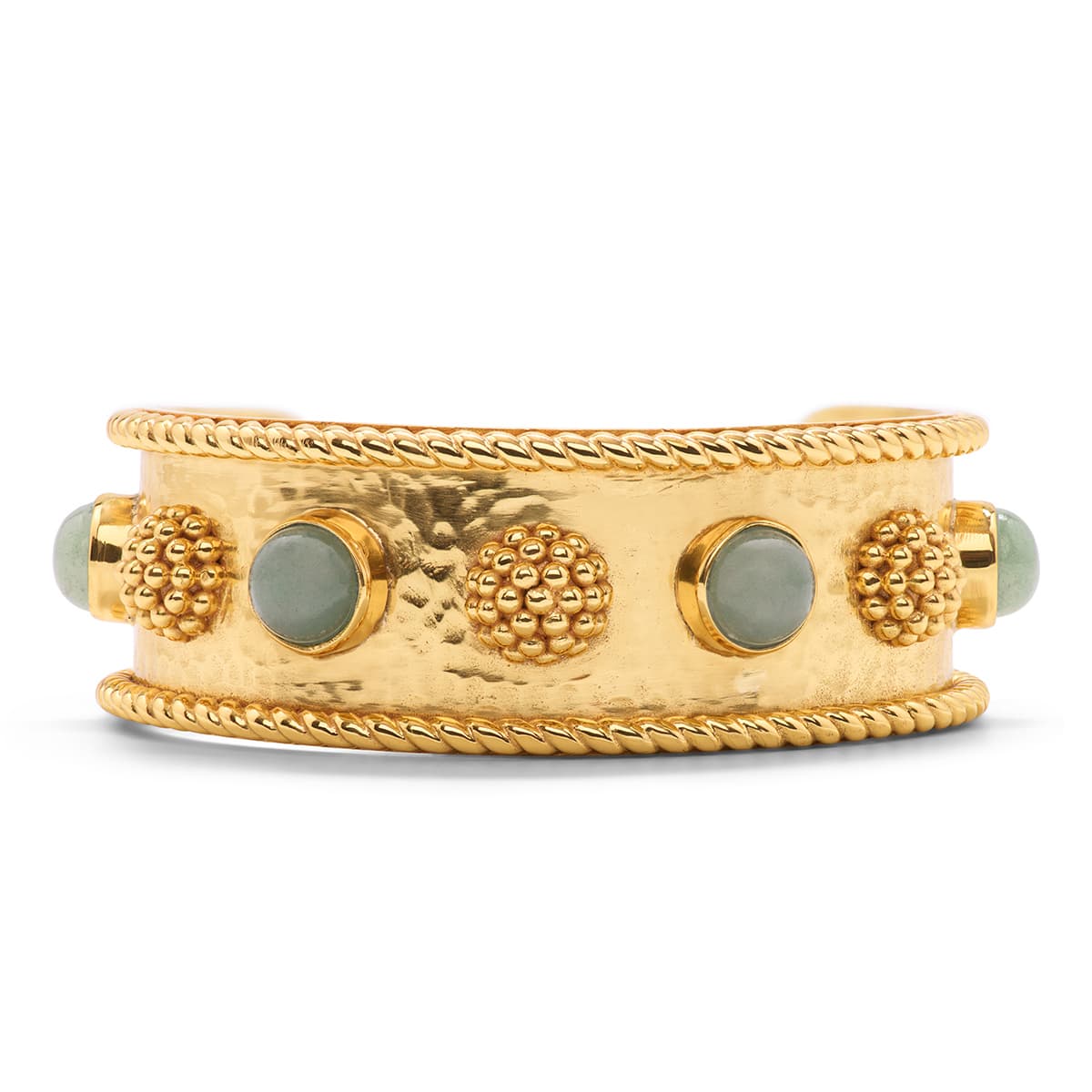 Gold bracelet with textured design and green stones on a white background