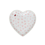 Heart-shaped ceramic plate with pink heart pattern on a white background