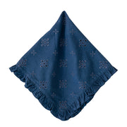 A navy blue cotton eyelet cloth napkin with a ruffled edge and embroidered floral motifs, displayed on a solid white background.