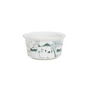 White bowl with green winter scene design on a white background