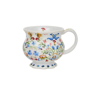Decorative mug with floral pattern on a white background