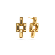 Gold geometric earrings on a white background