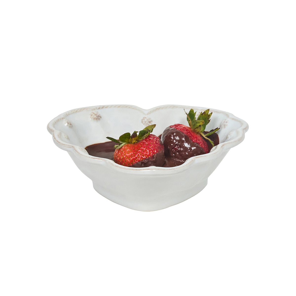 White decorative bowl with strawberries and chocolate on a white background