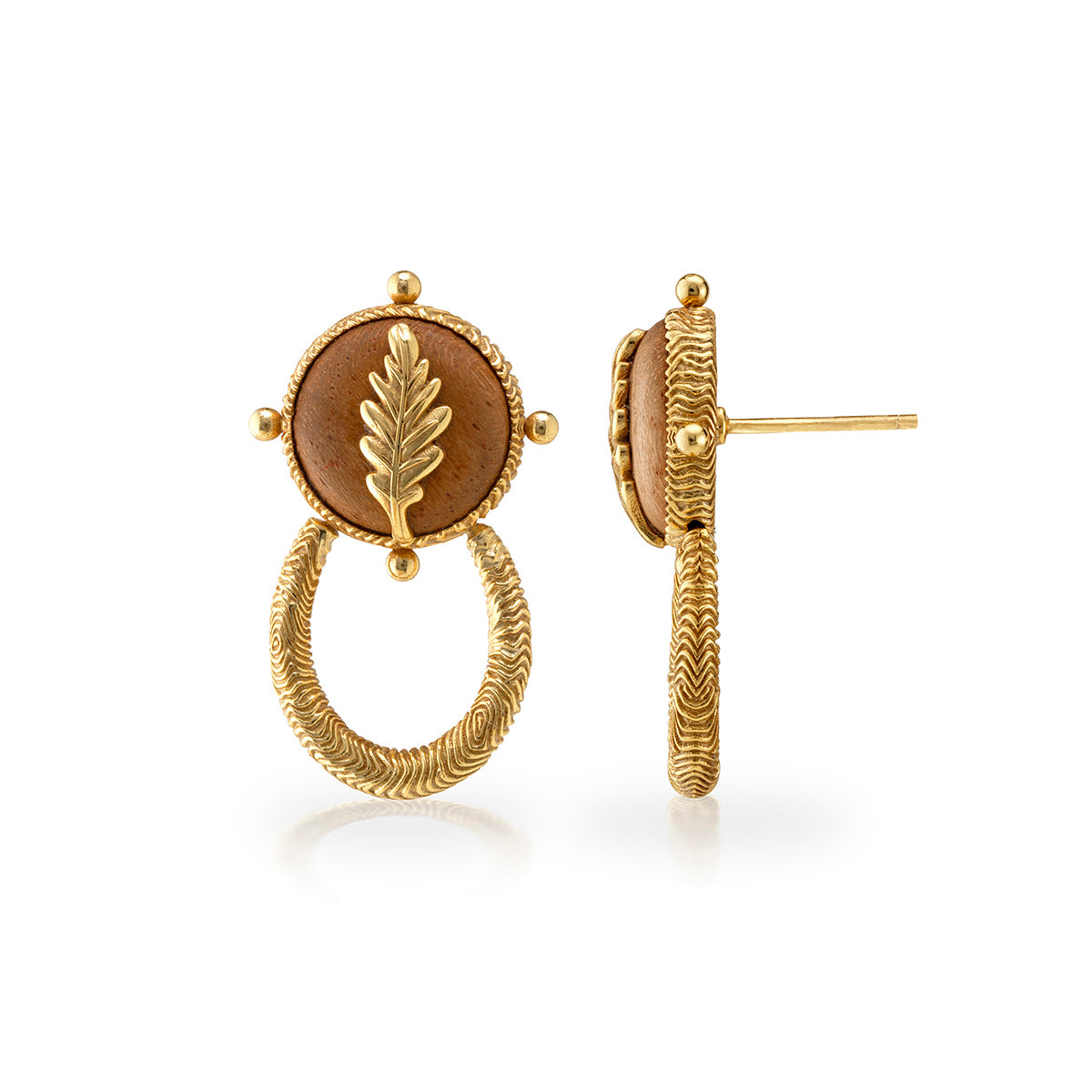 Gold earrings with a central brown stone and leaf design on a white background