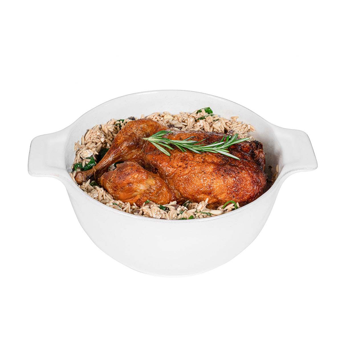 Roasted chicken with stuffing in a white dish on a white background