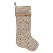 Decorative Christmas stocking with embroidered stars on a beige background