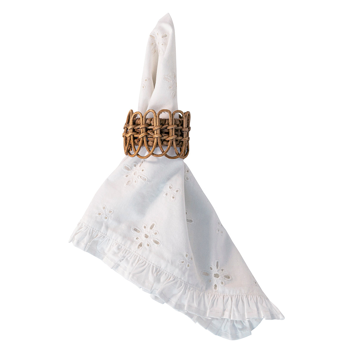 A white eyelet cotton napkin with a ruffled hem, folded and held upright by a woven brown paperclip-style napkin ring, isolated on a white background.