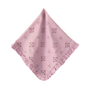Pink embroidered napkin with ruffled edge on a white background