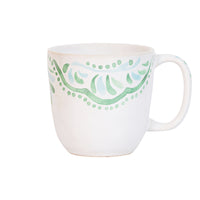 The beguiling pattern of this mug cup was inspired by the intricately painted tiles we found on an escapade to the Iberian Coast. Featuring a verdant palette of soft sage and sky-blue hues that are both refreshing and soothing - you will want to use this gorgeous green mug for a fresh start in the morning with coffee or tea or filled with decadent hot chocolate on a cozy afternoon.