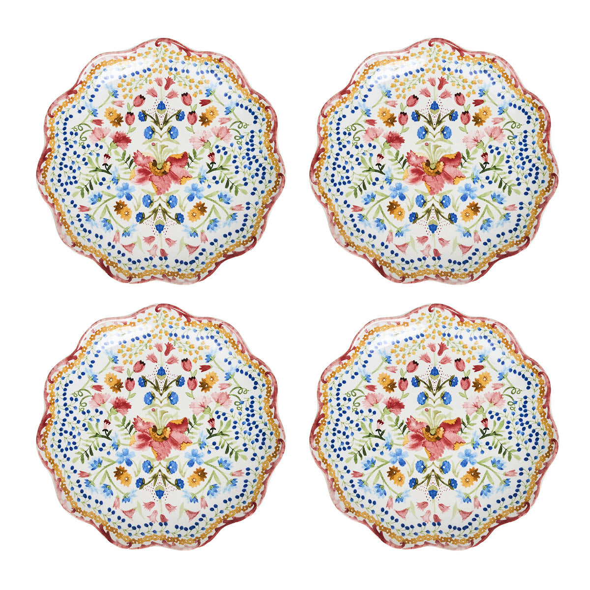Set of four floral-patterned plates on a white background