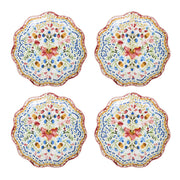 Set of four floral-patterned plates on a white background