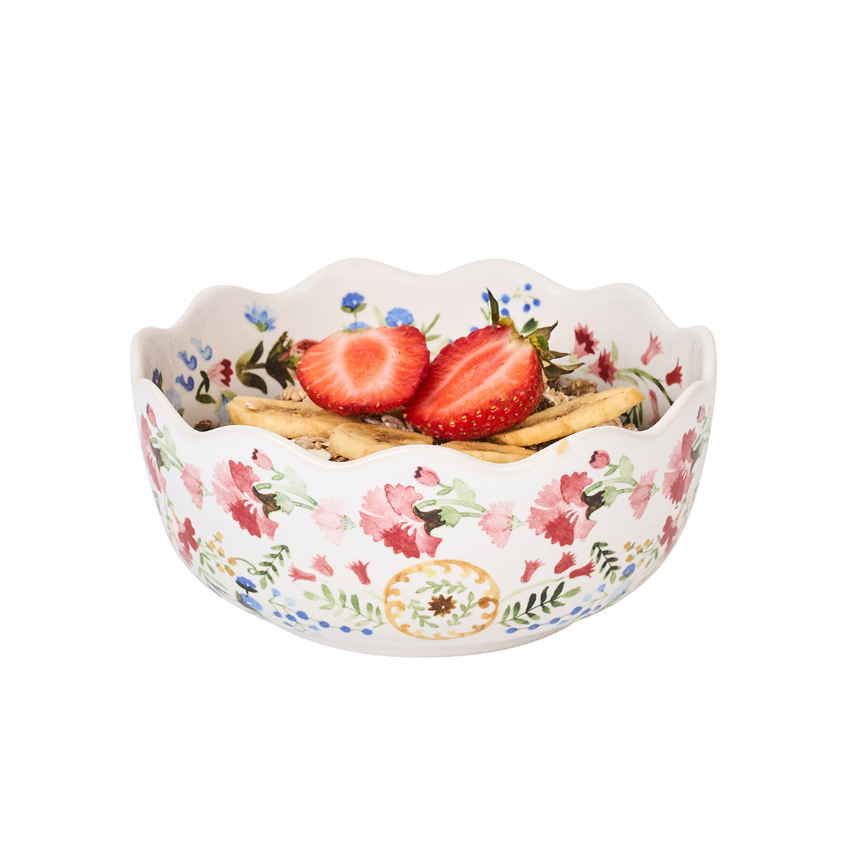 Decorative ceramic bowl with floral pattern containing strawberries and crackers on a white background
