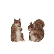 Two squirrel figurines on a white background