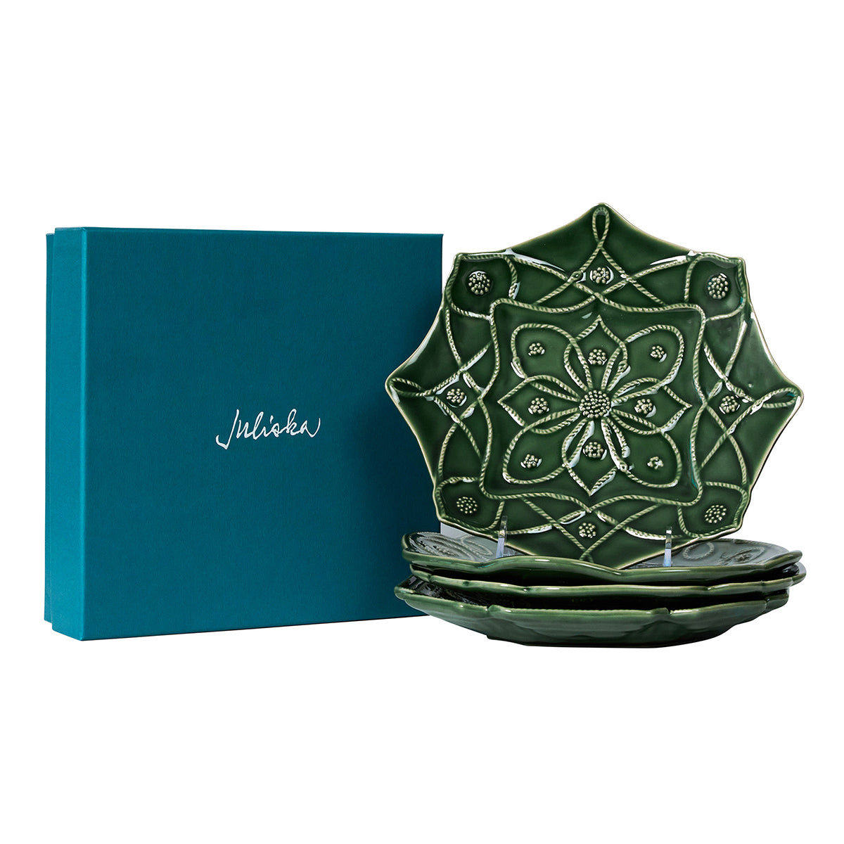 Green plates stacked in front of a teal gift box