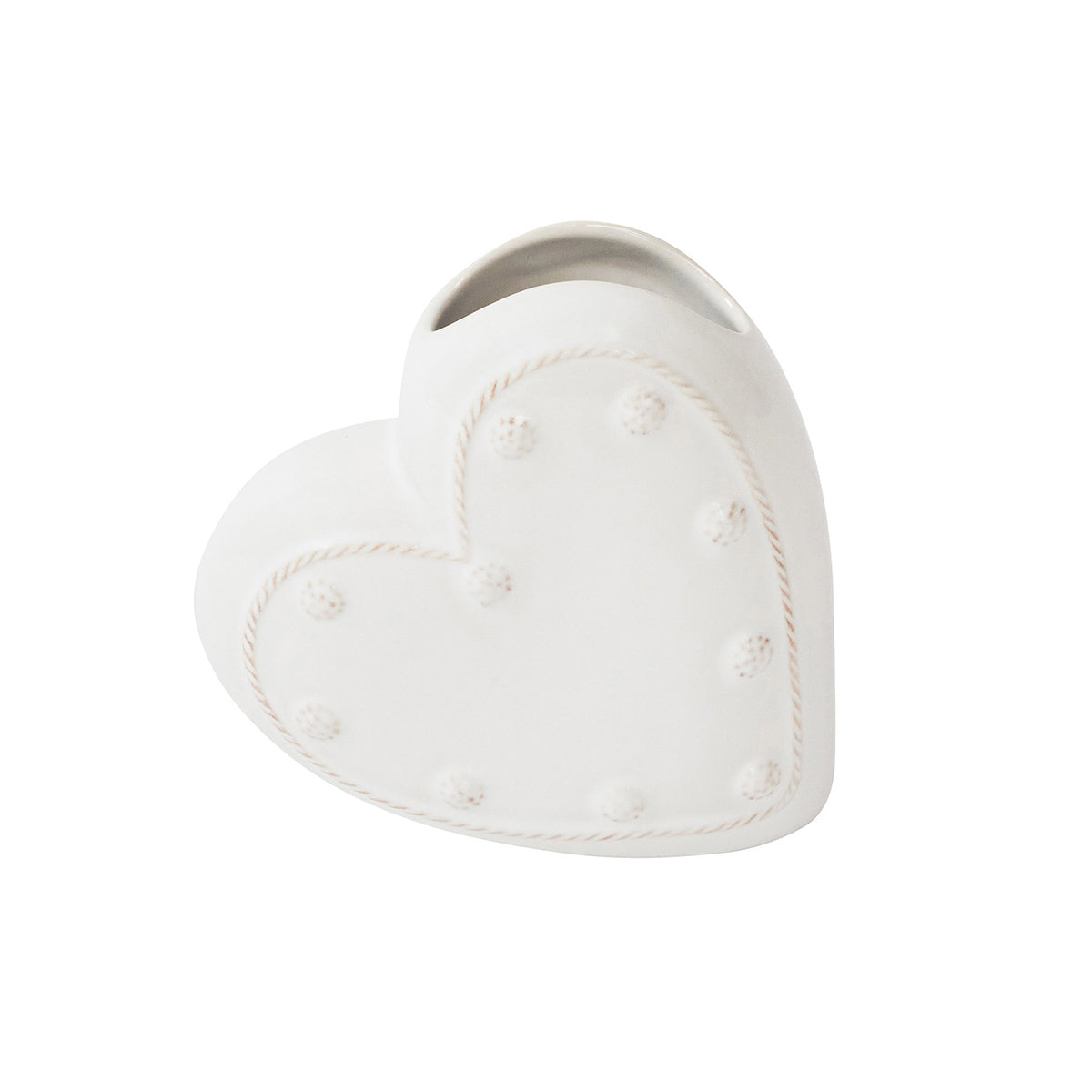 Heart-shaped white ceramic planter with decorative holes on a white background