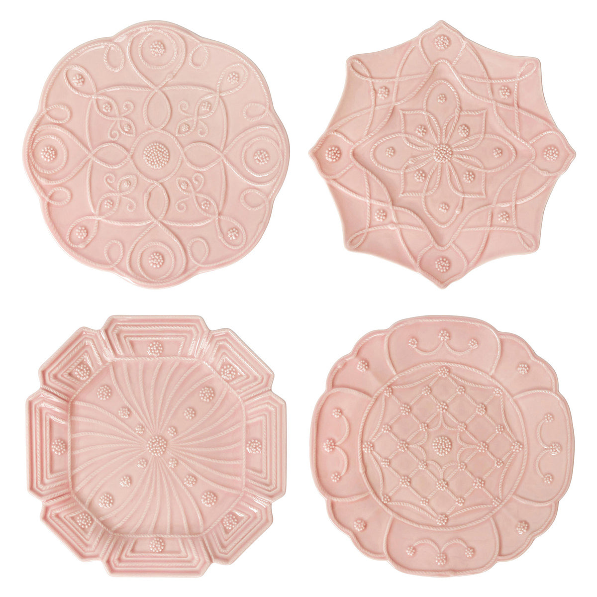 Set of four pink plates with embossed patterns on a white background