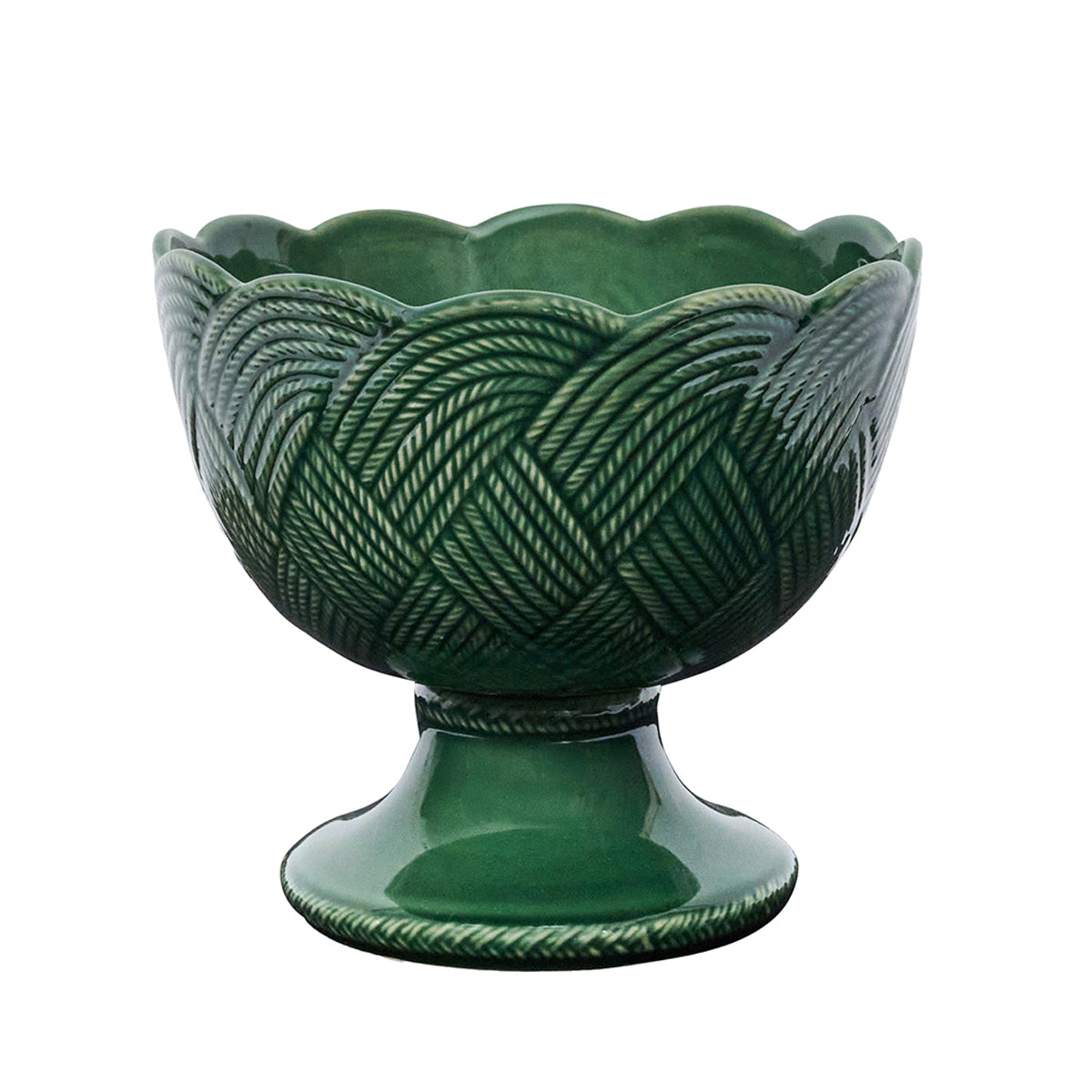 Green ceramic bowl with textured design on a white background