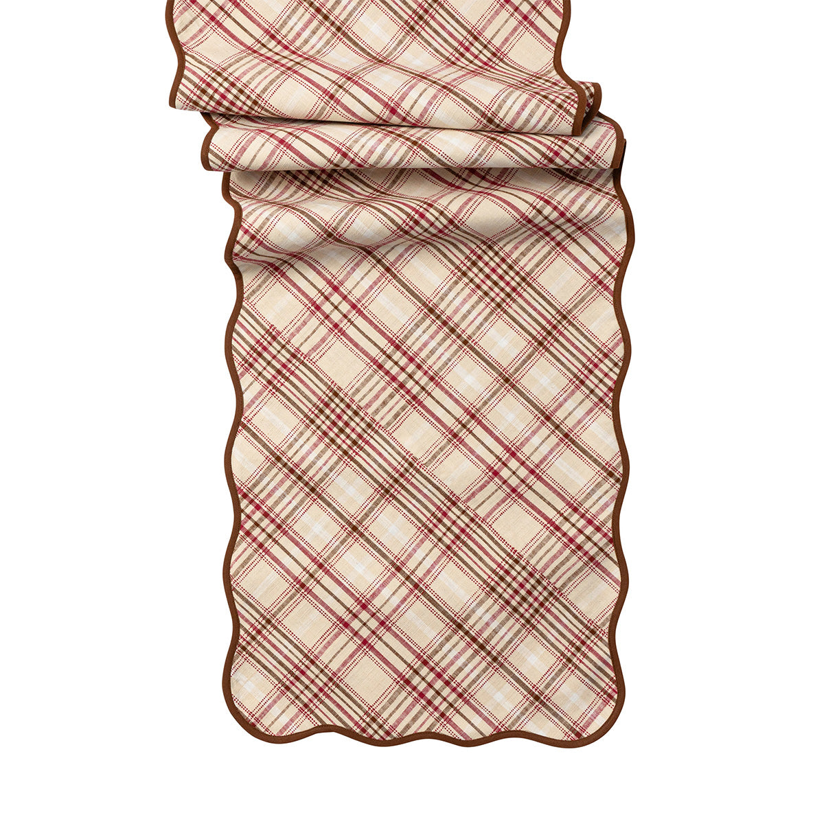 Plaid table runner with scalloped edge on a white background