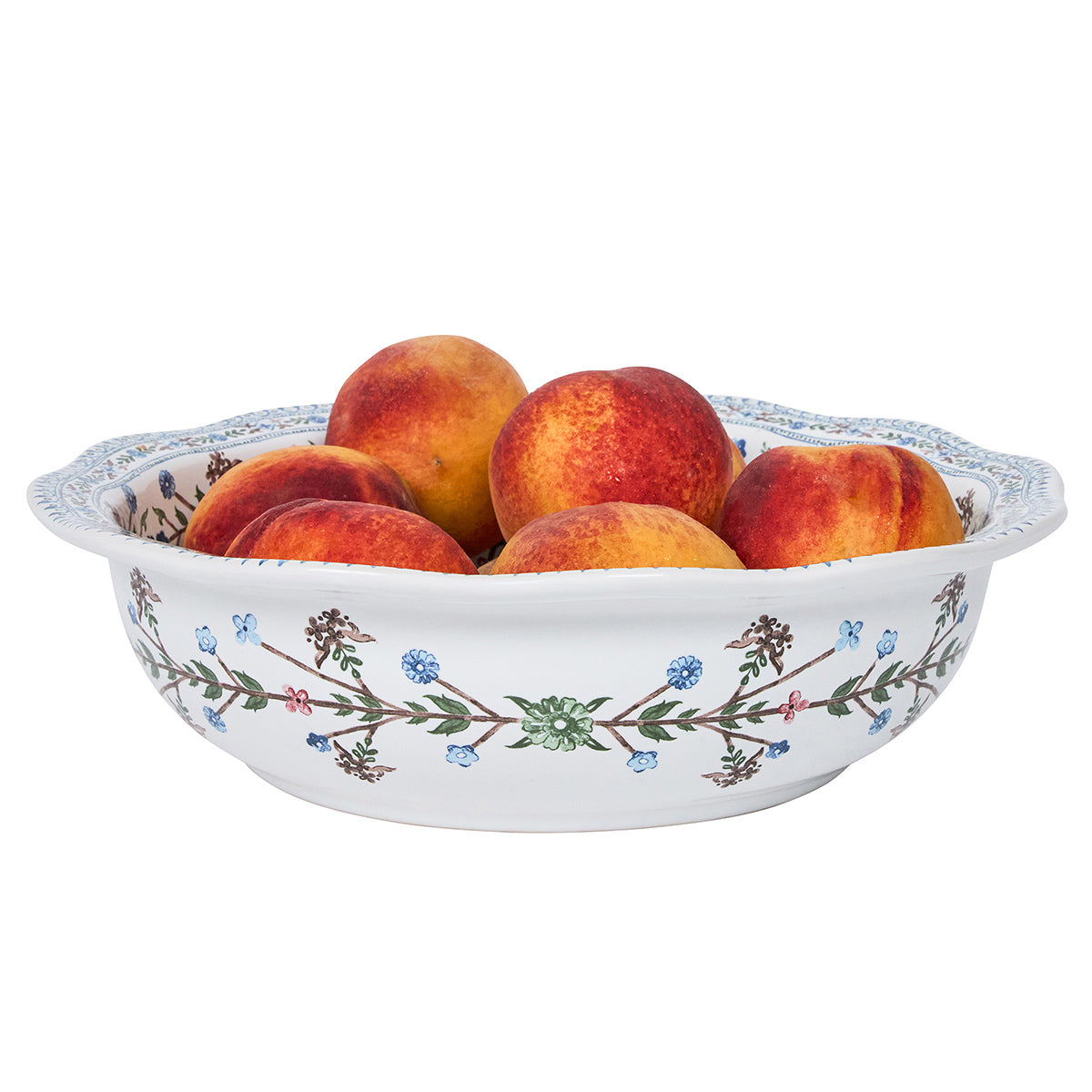 Decorative bowl with peaches on a white background