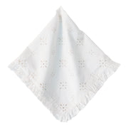 A white cotton eyelet cloth napkin with a delicate ruffled border and small floral cutwork pattern, displayed on a clean white background.