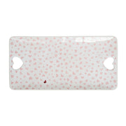 Platter with pink heart pattern on a white background