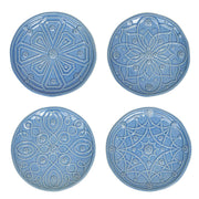 Four blue ceramic plates with decorative patterns on a white background