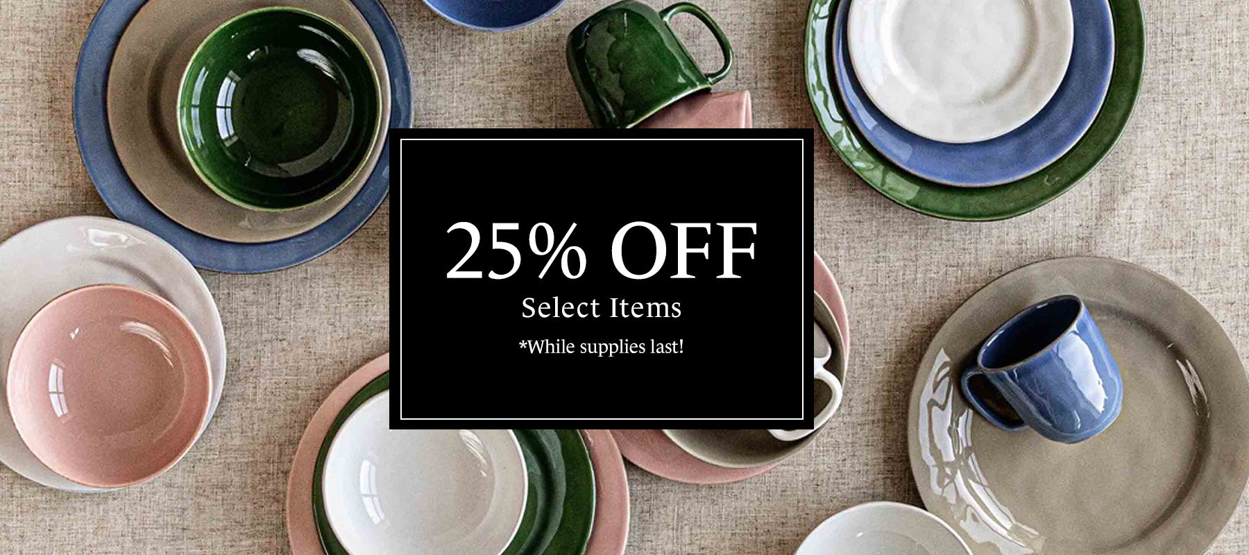 Puro ceramics laid out on a linen tablecloth. Text overlay that says "25% off select items while supplies last!"