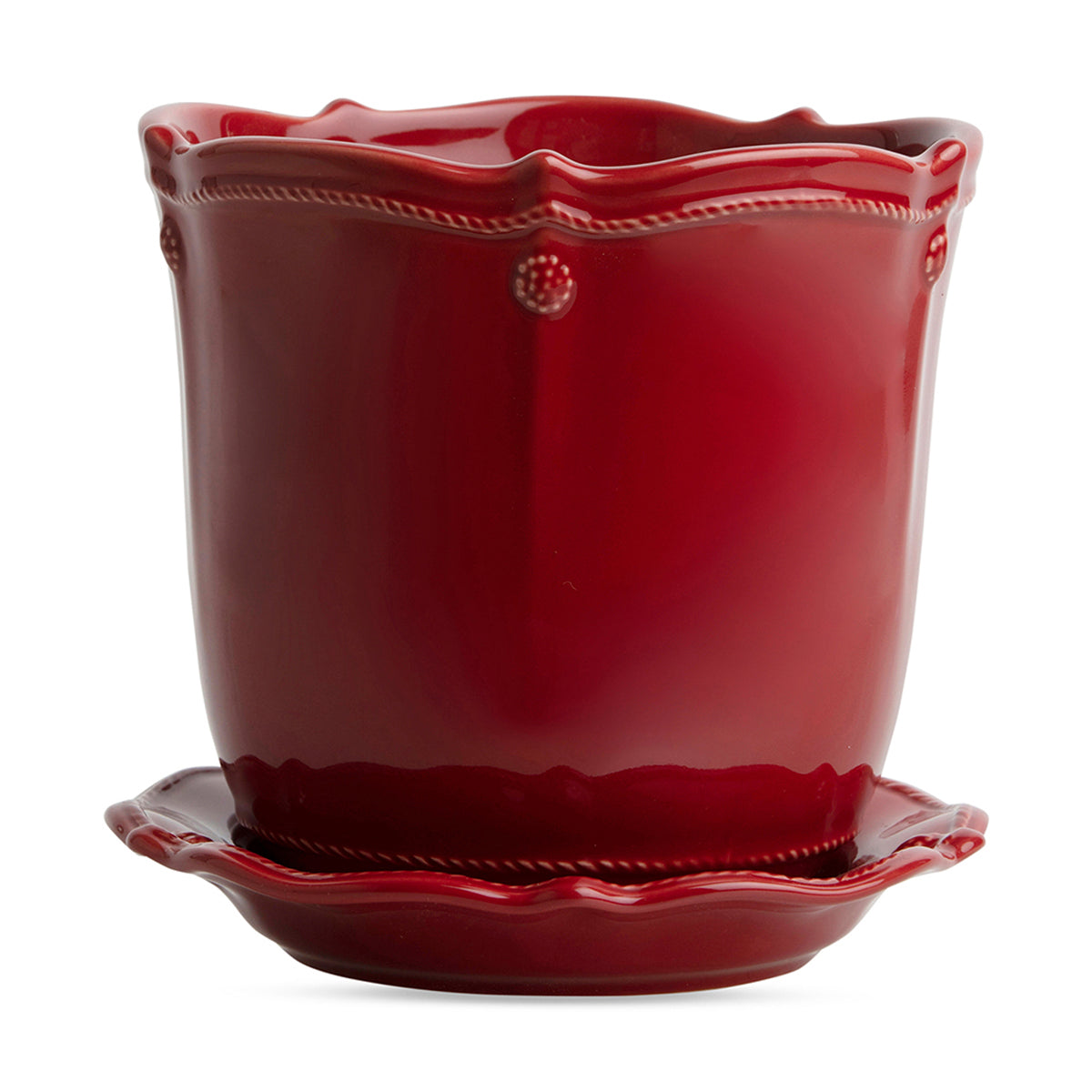Beautifully display your plants in a festive red Berry &amp; Thread ceramic planter. Designed with function in mind, each has a small hole at the bottom for drainage and comes with a corresponding saucer. This 7-inch size hosts medium plants such as Holiday poinsettias and orchids or ferns and greenery and looks darling when clustered in a grouping.