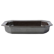 A rectangular dark gray cast iron baking pan with a hammered finish and flared corners, shown from a front-three-quarters angle on a solid white background.