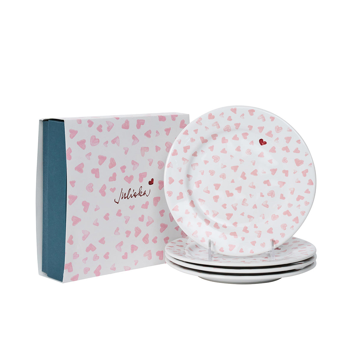 Set of ceramic plates with heart pattern and matching box on a white background