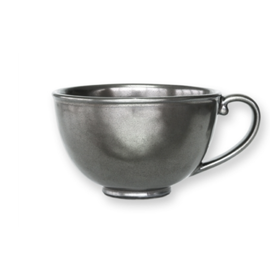 Metallic silver teacup on a white background