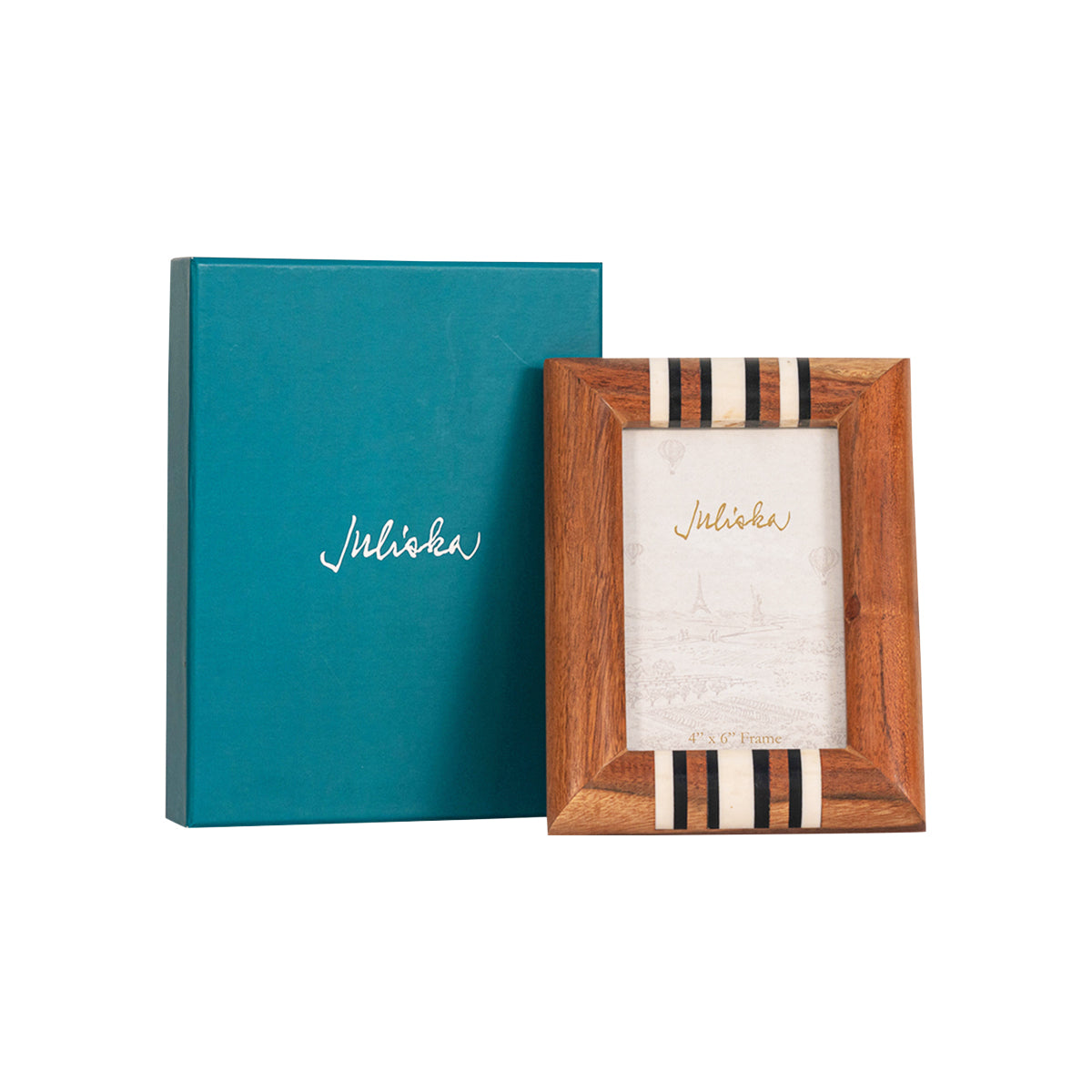 Teal photo album with 'Juliska' branding next to a wooden picture frame with a striped design.