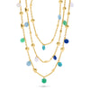 Gold necklace with several precious stones attached.