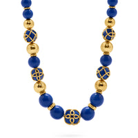 Elizabetta Cage bead necklace made with gold and lapis.