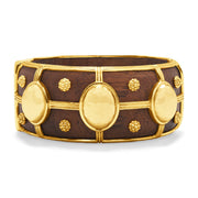 Gold and brown bracelet on a white background