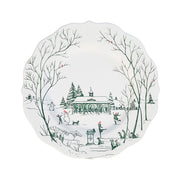 Decorative plate with winter scene design featuring trees, a gazebo, and people in a snowy landscape.