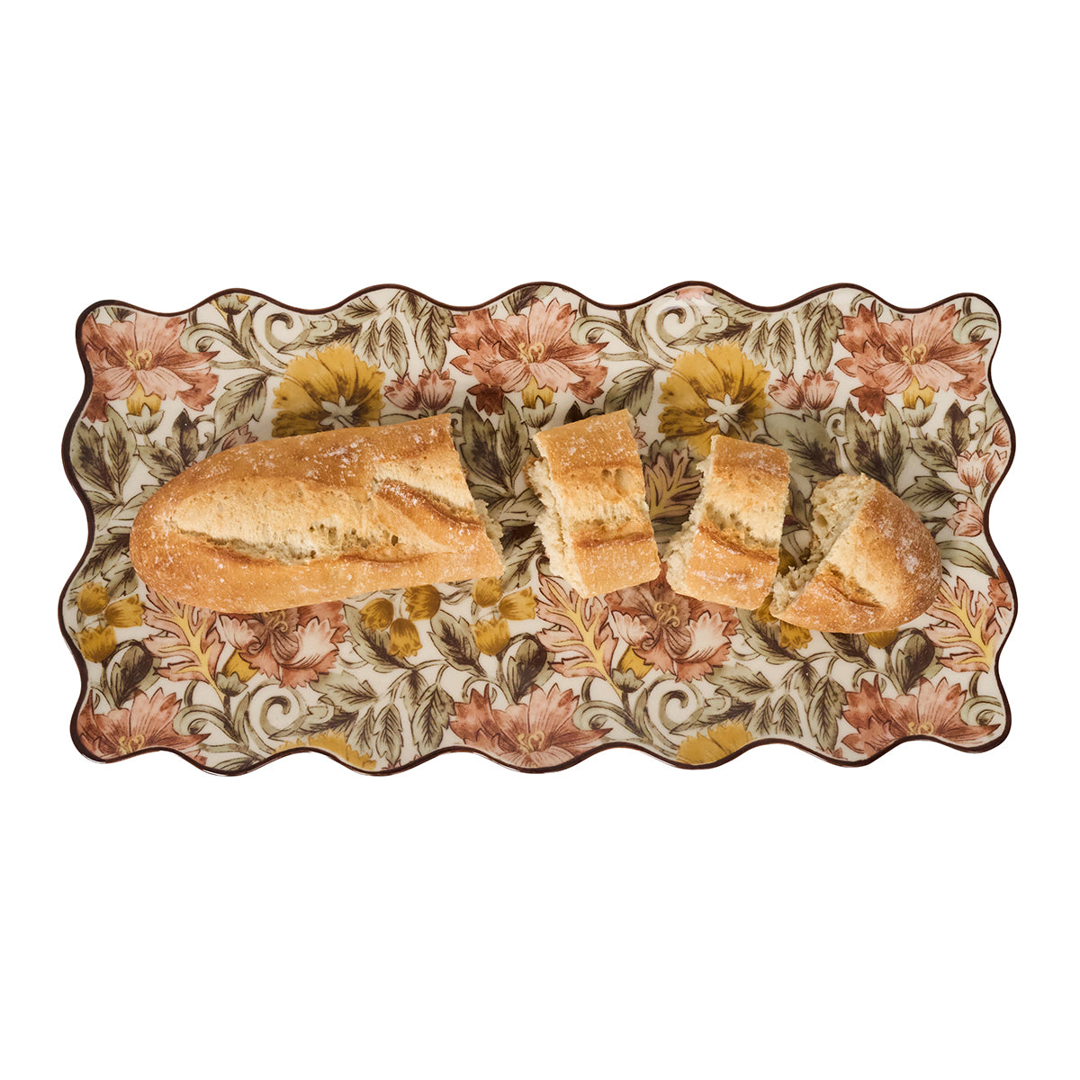 Decorative plate with floral patterns holding slices of bread on a white background