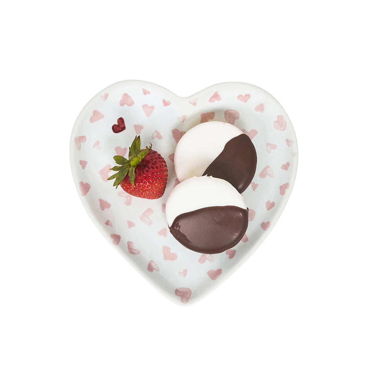 Heart-shaped dish with a strawberry, marshmallows, and chocolate on a white background