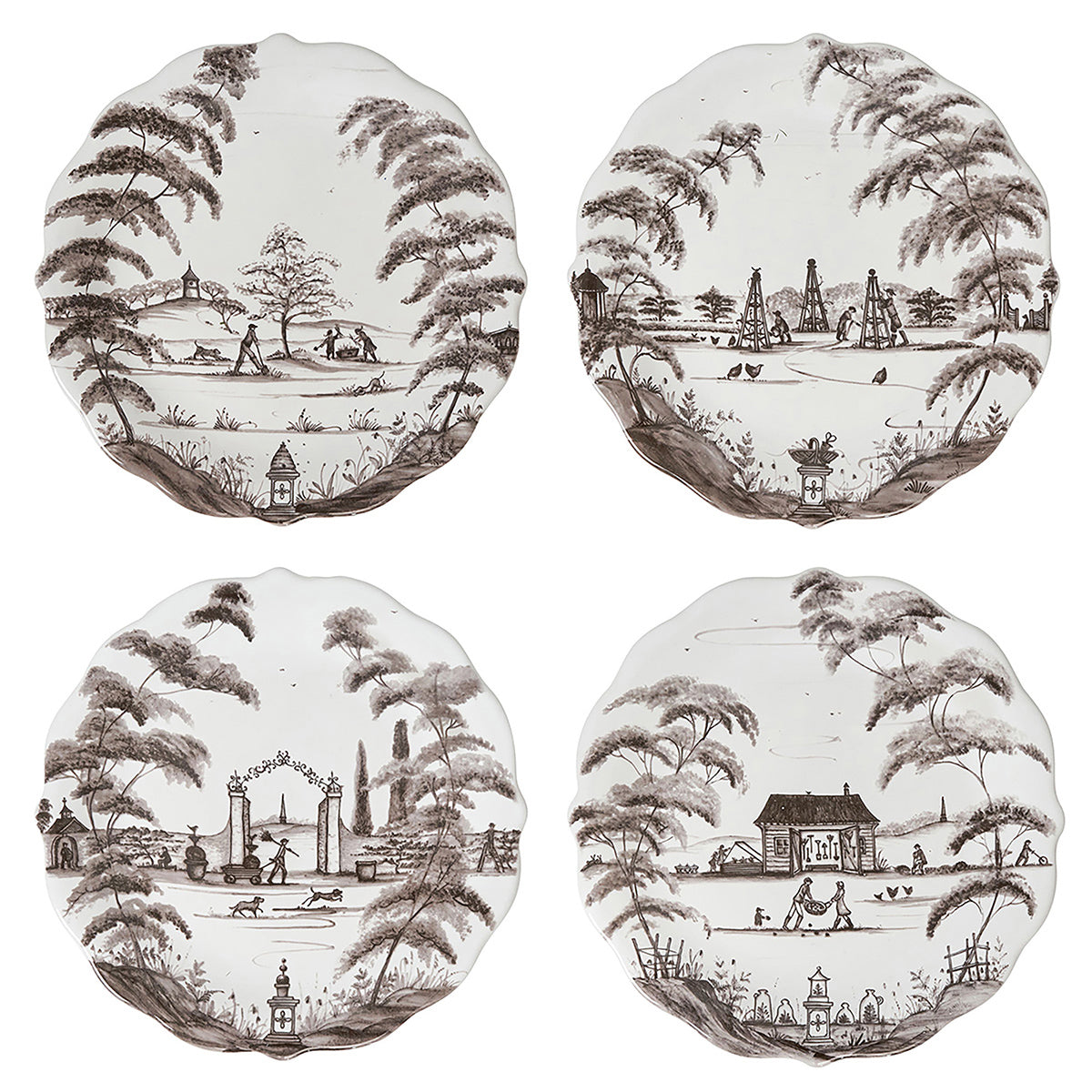 Four round ceramic coasters with black and white landscape designs on a white background.