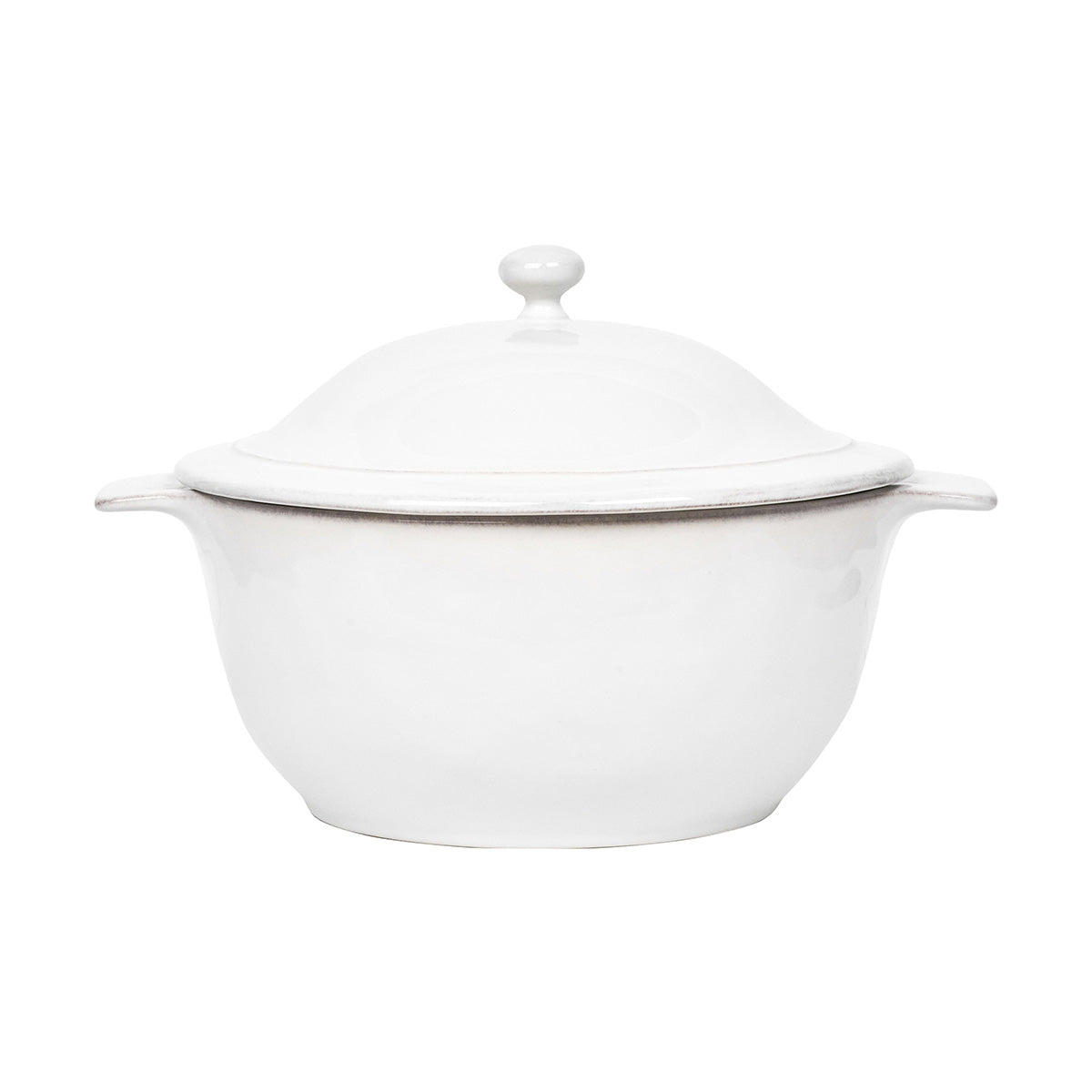 White ceramic casserole dish with lid on a white background